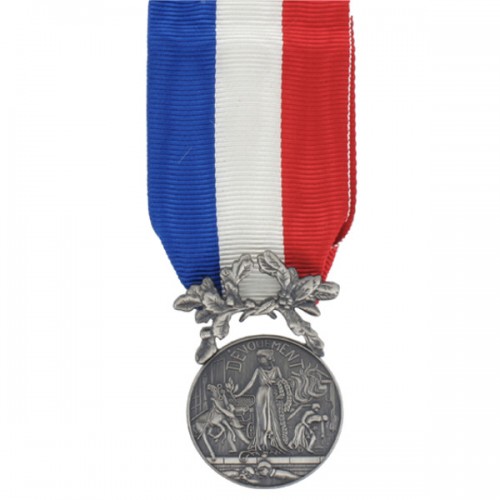MÉDAILLE -COURAGE ET DÉVOUEMENT